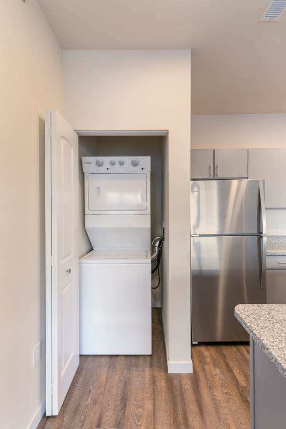 A white oven and refrigerator in a kitchen.