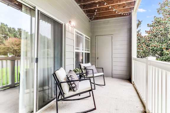 A patio with a table and chairs is shown.