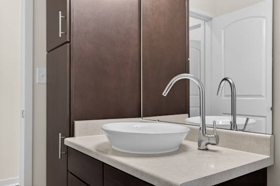 A white bowl is sitting on a marble countertop.