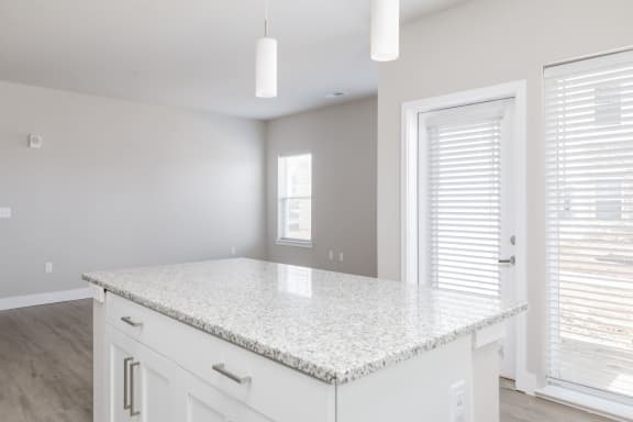 a kitchen with white cabinets and a white counter top  at The Edison at Tiffany Springs, Kansas City, MO, 64153