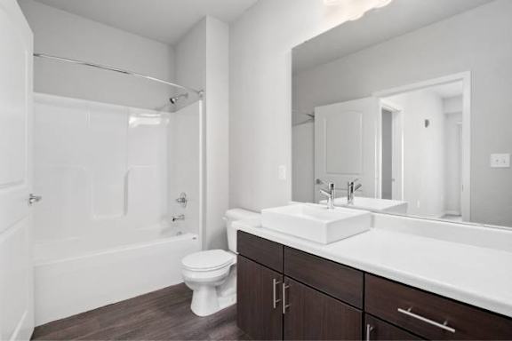 A white sink is on a countertop in a bathroom at Aventura at Wentzville I & II Apartments, Missouri
