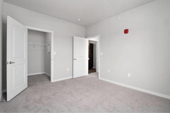 A room with white doors and a red square on the wall at Aventura at Wentzville I & II Apartments, Wentzville, MO