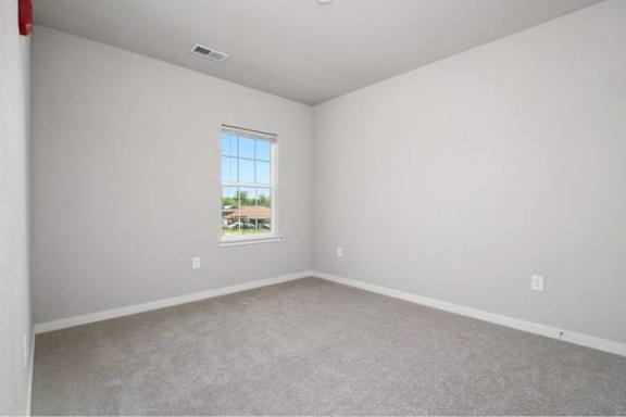 A room with a window and a view of the outside at Aventura at Wentzville I & II Apartments, Wentzville, 63385