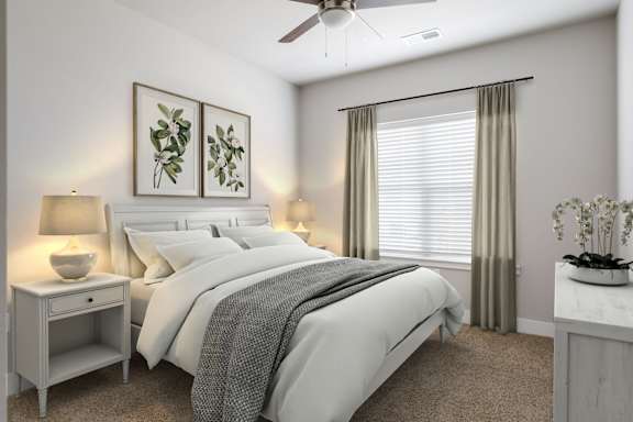 A bedroom with a bed, nightstand, and a ceiling fan.
