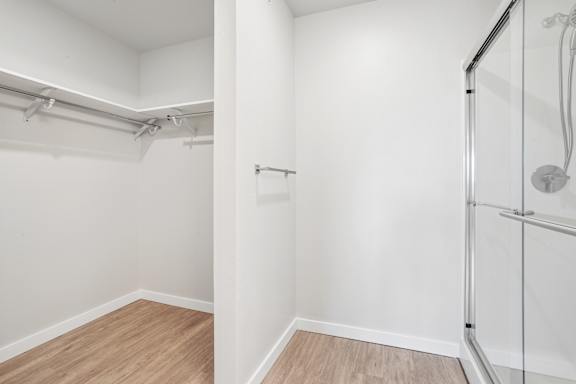 A white bathroom with a walk-in shower.