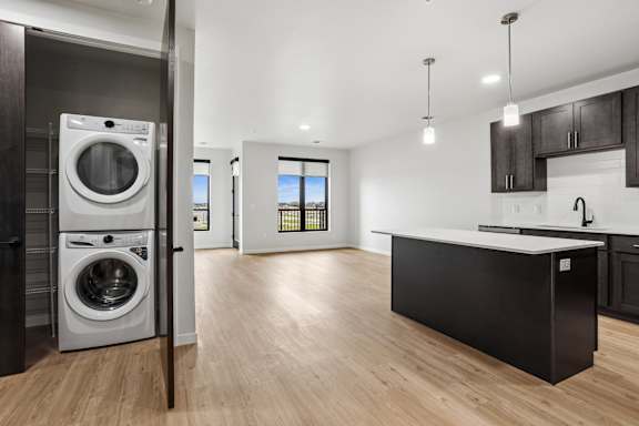 A modern laundry room with a washer and dryer.