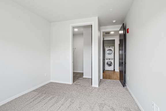 A laundry room with a washer and dryer.