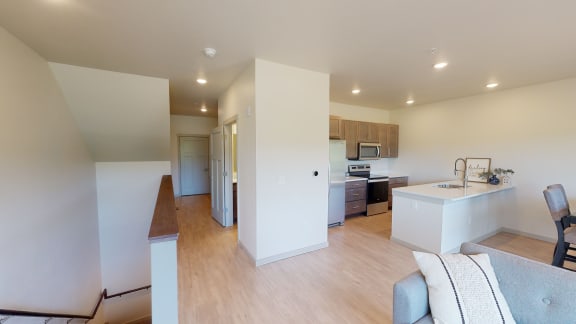 View of first floor, kitchen, dining, hallway and stairs