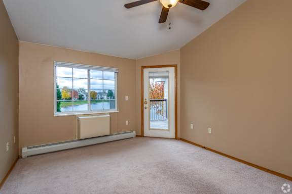 A room with a window and a door.
