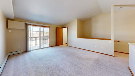Empty room with a door and a window.