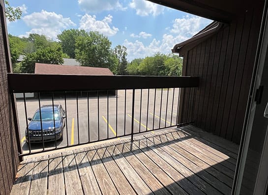 a car parked in a parking lot next to a building