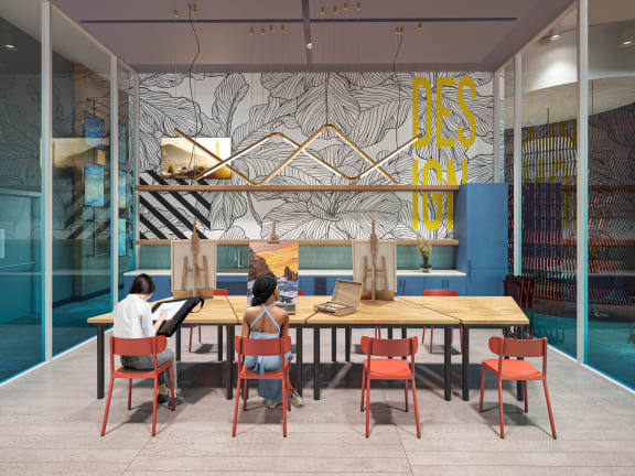 a rendering of people sitting at a table in a room with a colorful wall