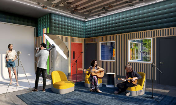 a group of people playing guitars in a room with a recording studio