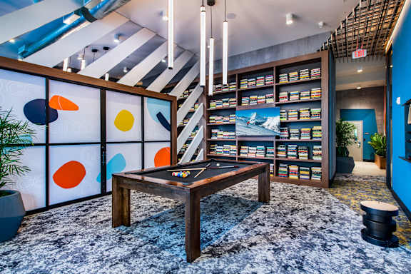 A room with a blue wall and a wooden table.