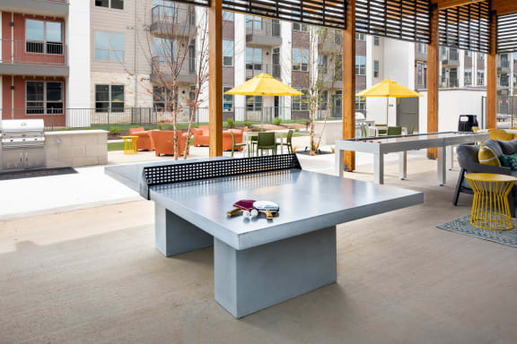 a ping pong table in an outdoor area of a building