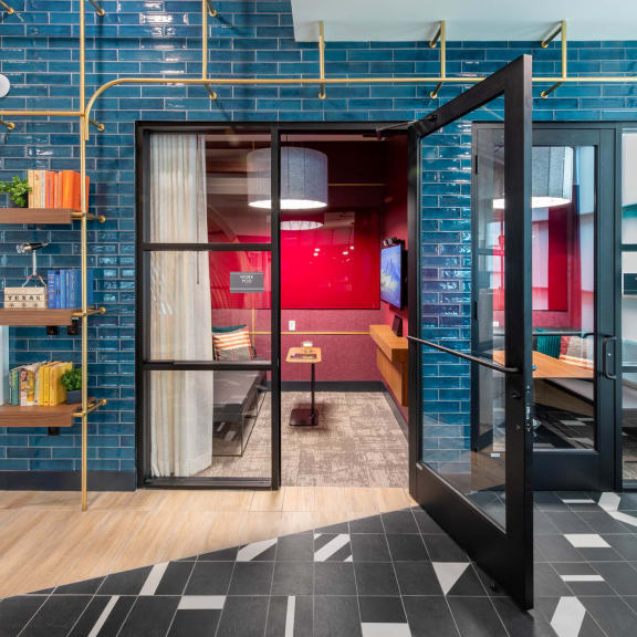 a room with blue and red walls and a sliding glass door