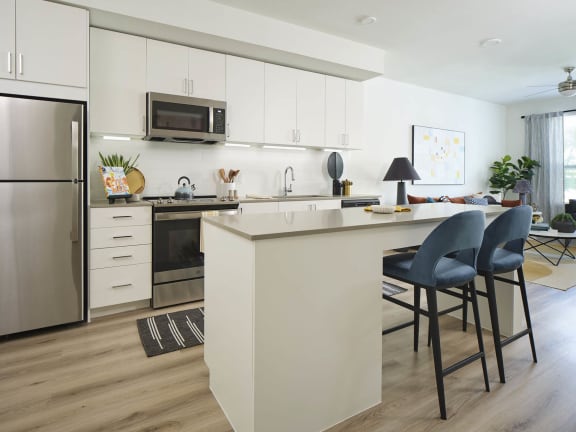 a kitchen with a counter and a refrigerator