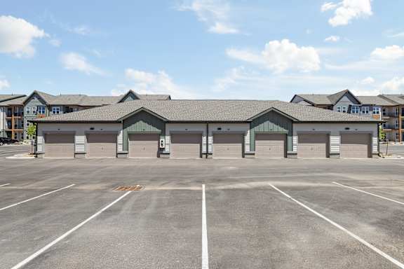 A parking lot with a building in the background.