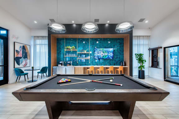 play a game of pool in our clubhouse at our apartments