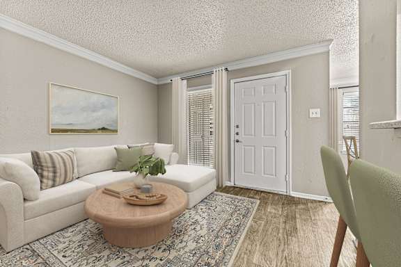 A living room with a white couch, a coffee table, and a painting on the wall.