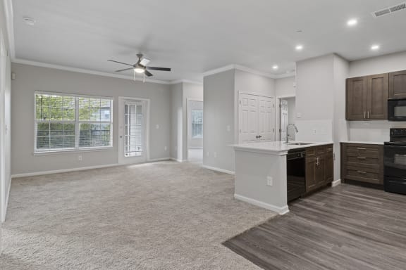 Living Area With Kitchen View at Remington Ranch, San Antonio, Texas