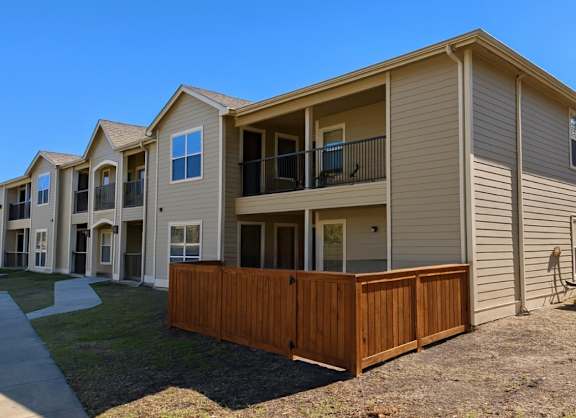 houses with wooden fence at Crosspoint Oaks at Boerne, Boerne, TX 78006