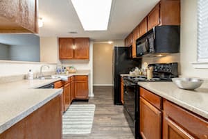 Cabinets of wood at Amberly Village Townhomes, Texas, 75040