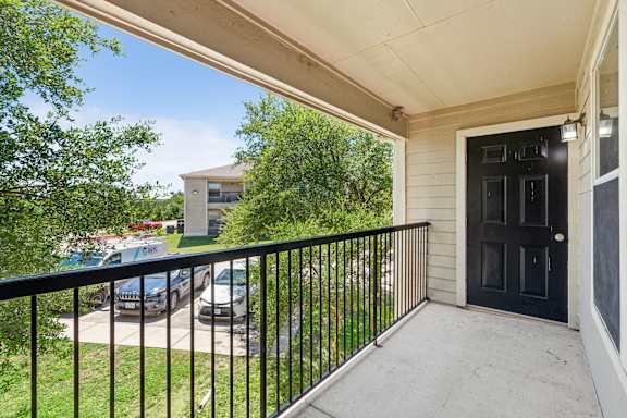 balcony with a black door at Crosspoint Oaks at Boerne, Boerne Texas