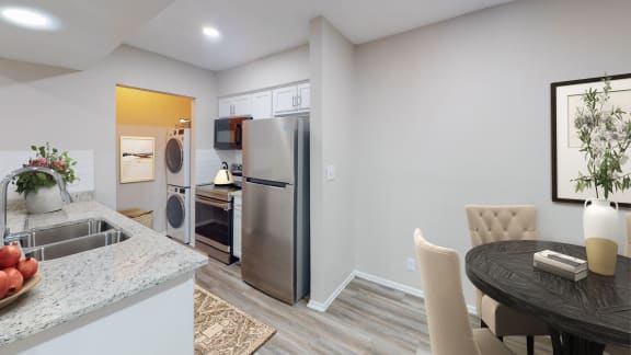a kitchen and dining area in a 555 waverly unit at The Frederick, San Antonio, TX 78240