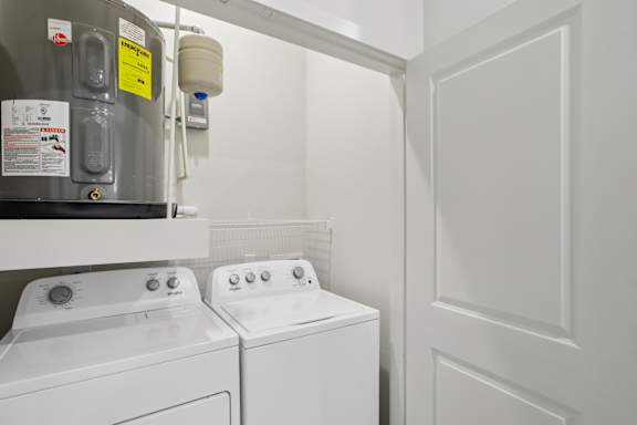 Laundry closet with side by side washer and dryer 1 at Cantarra Apartments, Manor