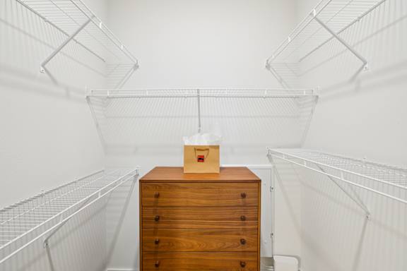 Walk-in closet with storage at Matador Apartments, Texas
