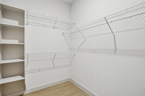 Empty white shelves in a room. at ThreeTwenty at the Vybe Apartments, Kyle, Texas