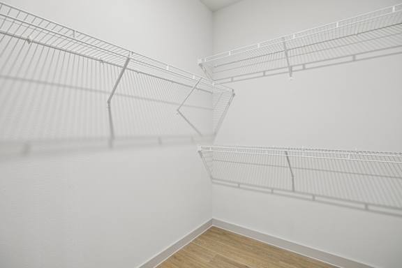 A white wall with a white shelf on it. at ThreeTwenty at the Vybe Apartments, Kyle, 78640