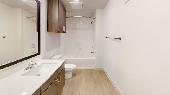 A white sink with a mirror above it.