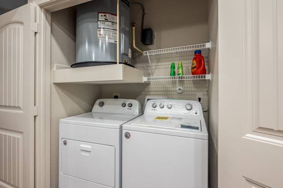 Inunit laundry with washer dryer and water heater at High Point Preserve Apartments, Austin