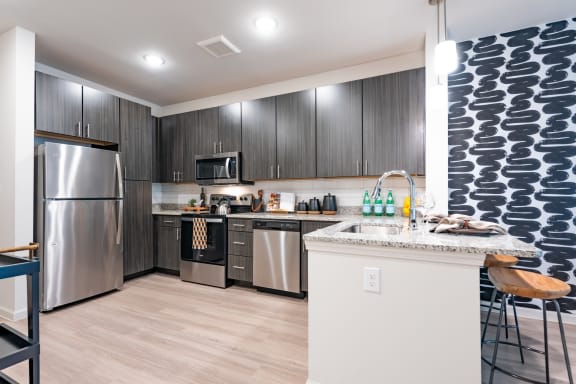 the heights on capitol hill apartments kitchen with stainless steel appliances at Avery Ranch, Austin Texas