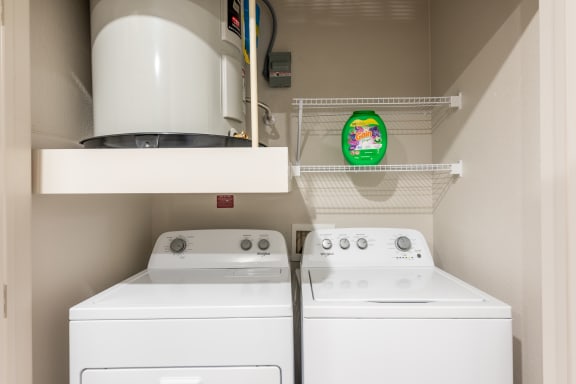 the laundry room has two washers and a dryer at Avery Ranch, Austin Texas