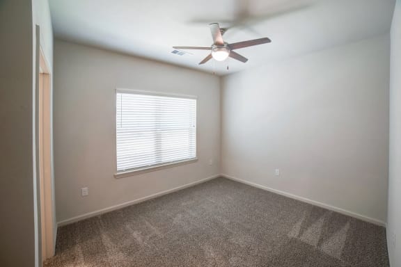 a bedroom with a ceiling fan and a window at Avery Ranch, Texas, 78717