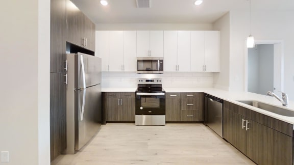 a kitchen and dining area in a 555 waverly unit at Avery Ranch, Austin