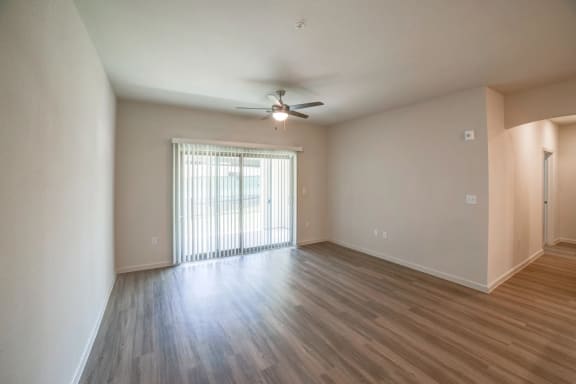 an empty living room with a ceiling fan at Avery Ranch, Austin, Texas