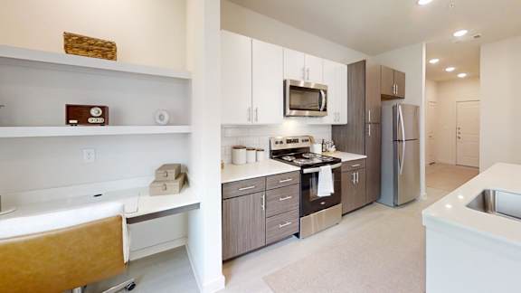 A modern kitchen with a white bathtub.