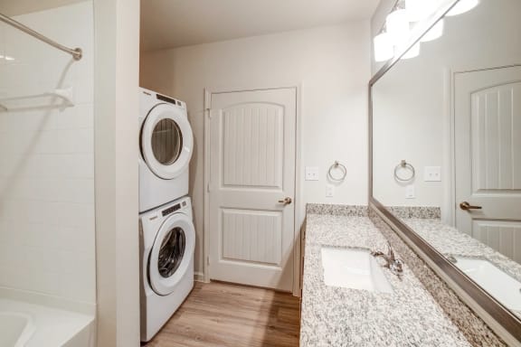 a bathroom with a washer and dryer at Avery Ranch, Texas