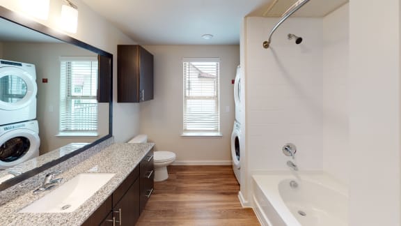 the avenues salt lake custom homes interior bathroom with granite countertops at Avery Ranch, Austin, 78717