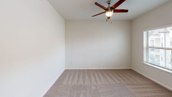 a bedroom with a closet and a ceiling fan at Avery Ranch, Austin Texas