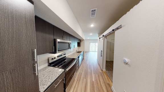 E1 Kitchen at Bridge at Paloma Apartments, Austin, 78754