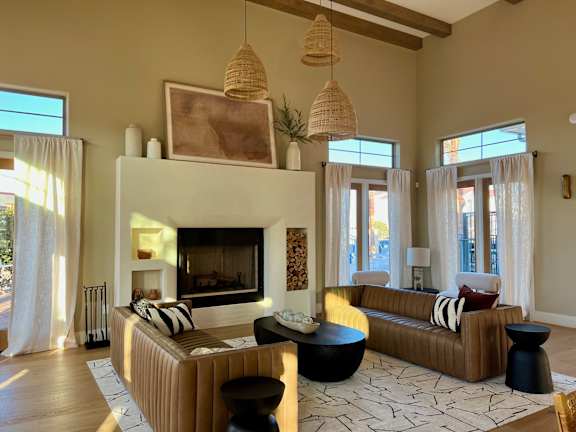 A living room with a fireplace and a couch. at Bridge at Delco Flats Apartments, Austin
