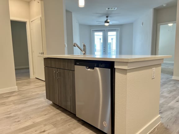 a kitchen with an island and a dishwasher
