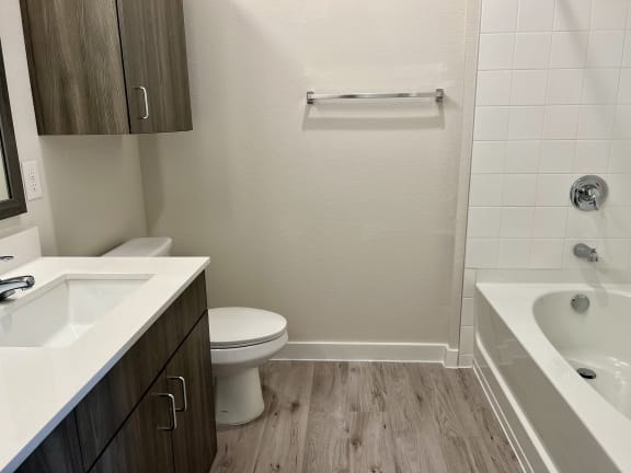 a bathroom with a toilet sink and bathtub