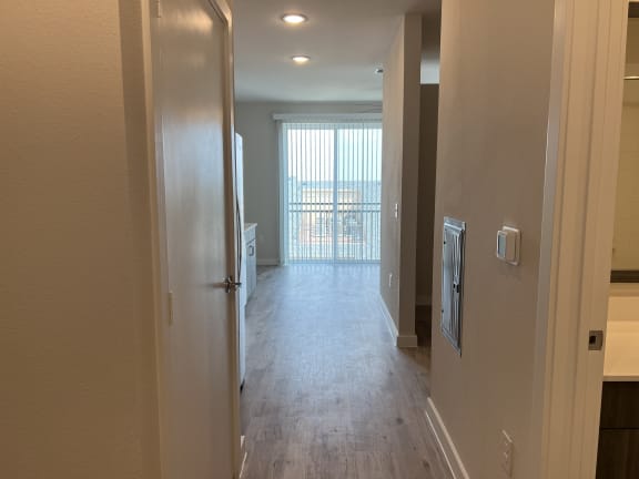 a look down the hallway of a bedroom apartment at the historic electric building apartments in fort worth