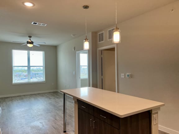 Kitchen island with pendant lighting at Bridge at Windsor Park Apartments, Austin, TX